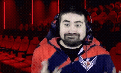 Bearded Man In Headphones And Logo Jacket Facing Crowd GIF