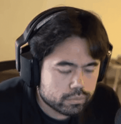 Bearded Man in Headphones Looking Down