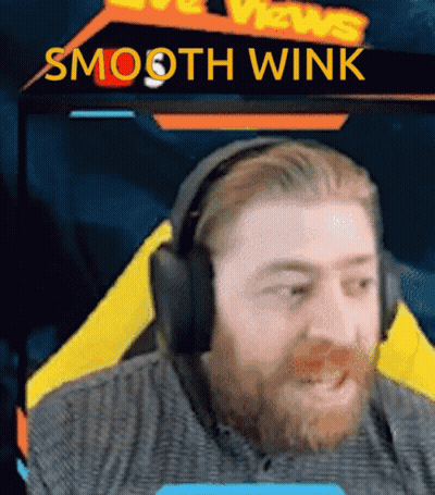 Bearded Man In Headphones With Smooth Wink Sign GIF