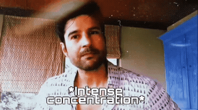 Bearded Man In Intense Concentration At Window GIF