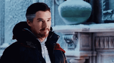 Bearded Man In Jacket By Fireplace In Snow GIF