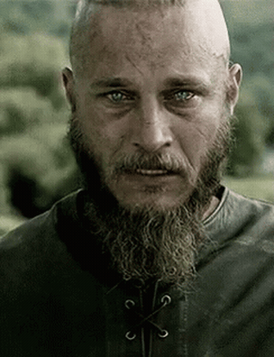 Bearded Man In Leather Jacket Looking At Camera GIF
