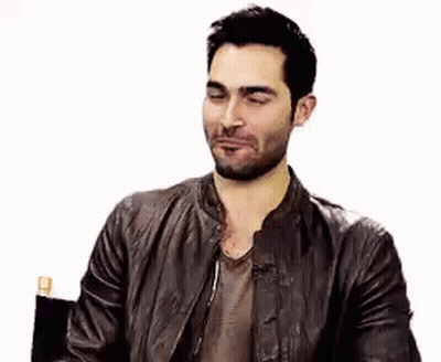 Bearded Man In Leather Jacket Sitting With Eyes Closed GIF