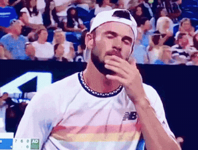 Bearded Man In New Balance Shirt Wiping Face GIF