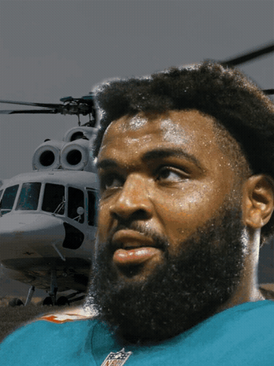 Bearded Man In NFL Shirt In Front Of Helicopter GIF