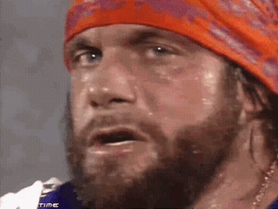 Bearded Man In Orange Headband And Purple Shirt Saying No GIF