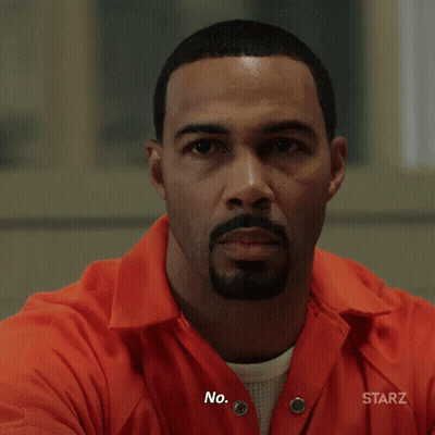 Bearded Man In Orange Prison Uniform Saying No GIF