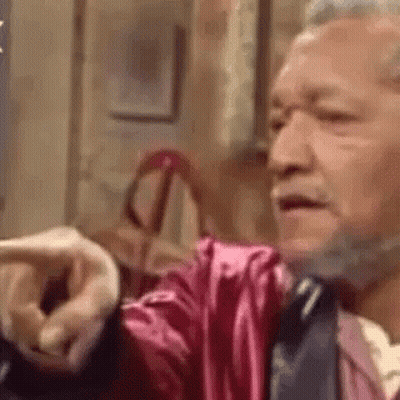 Bearded Man In Pink Robe Pointing GIF