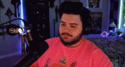 Bearded Man In Pink Shirt At Microphone GIF