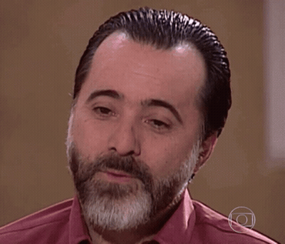 Bearded Man In Pink Shirt With Neck Circle GIF