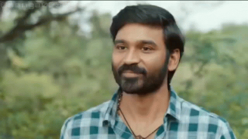 Bearded Man In Plaid Shirt And Necklace GIF