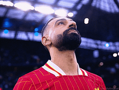 Bearded Man In Red And Yellow Striped Shirt Looking Up GIF