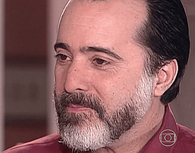 Bearded Man In Red Shirt And Circle Necklace GIF