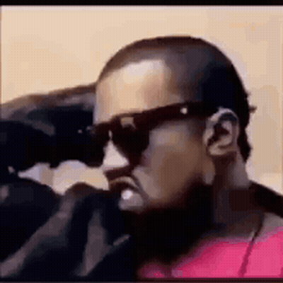 Bearded Man In Red Shirt Looking Through Binoculars GIF