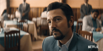 Bearded Man In Restaurant With Netflix Logo GIF