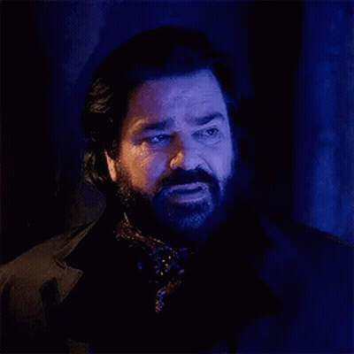 Bearded Man In Scarf With Blue Light GIF