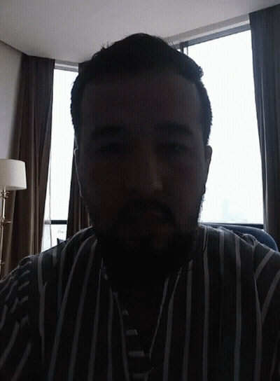 Bearded Man In Striped Shirt GIF