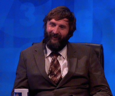 Bearded Man In Suit And Tie Hands In Air GIF