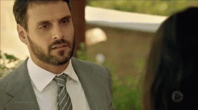 Bearded Man In Suit And Tie Looking At Woman GIF