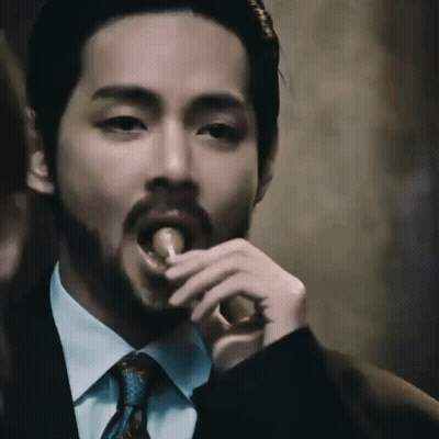 Bearded Man In Suit Eating Meat GIF