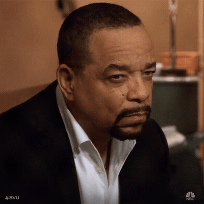 Bearded Man In Suit Looking At Camera GIF