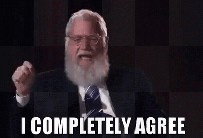 Bearded Man In Suit Making Gesture GIF