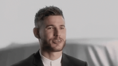 Bearded Man In Suit Talking To Someone GIF