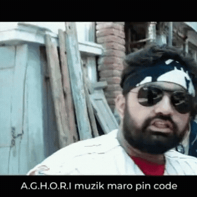 Bearded Man In Sunglasses And Bandana By Wood Pile GIF