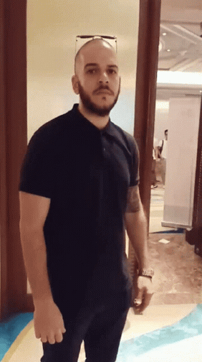 Bearded Man In Sunglasses And Black Polo GIF