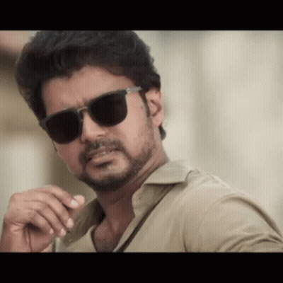 Bearded Man In Sunglasses And Khaki Shirt GIF