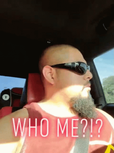 Bearded Man In Sunglasses And Red Tank Top Saying Who Me GIF