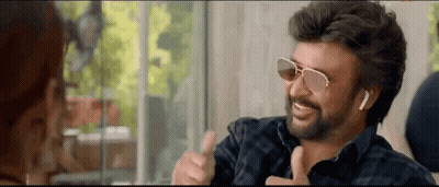 Bearded Man In Sunglasses Thumbs Up To Woman GIF