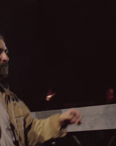 Bearded Man In Tan Jacket And White T-Shirt GIF