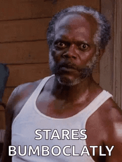 Bearded Man In Tank Top Staring Bumboclatly GIF