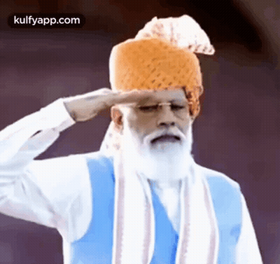 Bearded Man In Turban And Blue Vest Saluting GIF