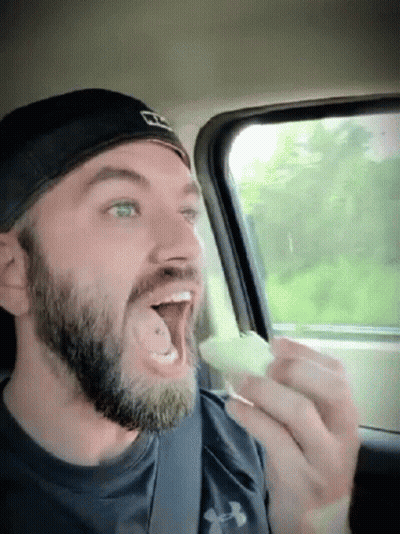 Bearded Man In Under Armour Shirt Eating GIF