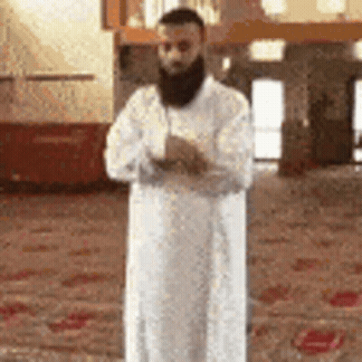 Bearded Man In White Robe Praying At Mosque GIF