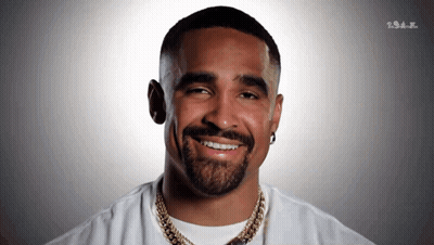 Bearded Man In White Shirt And Gold Chains Smiling GIF