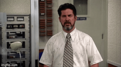 Bearded Man In White Shirt And Tie In Hallway GIF