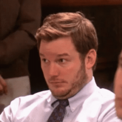 Bearded Man In White Shirt And Tie Looking GIF