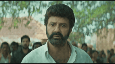 Bearded Man In White Shirt Before Crowd GIF