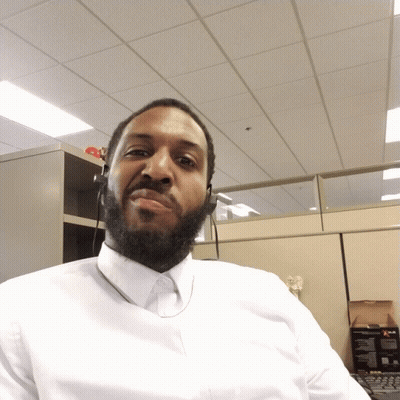 Bearded Man In White Shirt Looking Down GIF