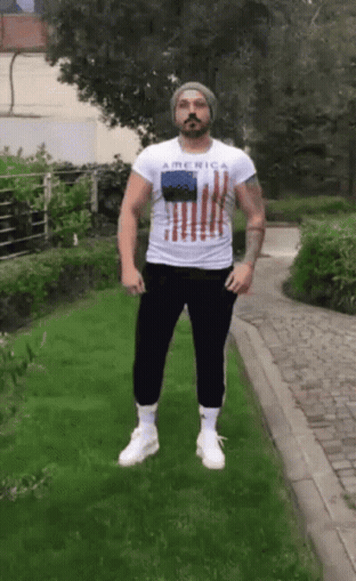 Bearded Man In White Shirt Saying America GIF