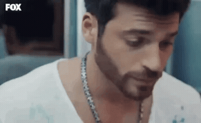 Bearded Man In White Shirt With Chain GIF