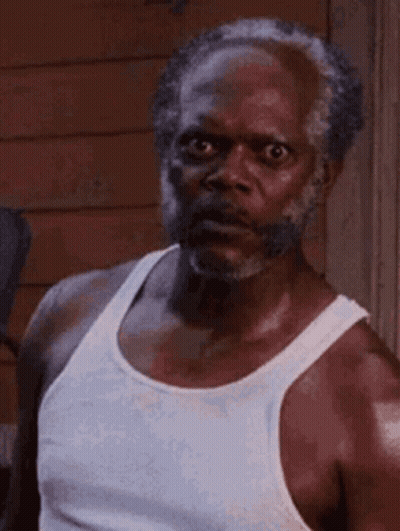 Bearded Man In White Tank Top Making Funny Face GIF
