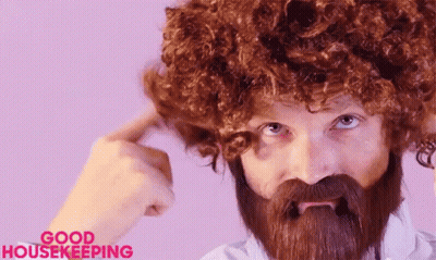 Bearded Man In Wig Making Funny Face GIF