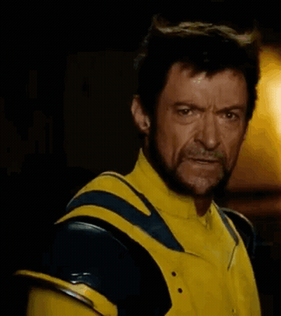 Bearded Man In Yellow Blue Superhero Costume GIF