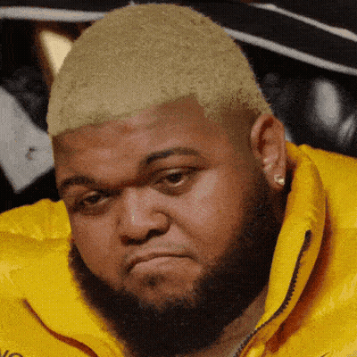 Bearded Man In Yellow Jacket With Letter N GIF