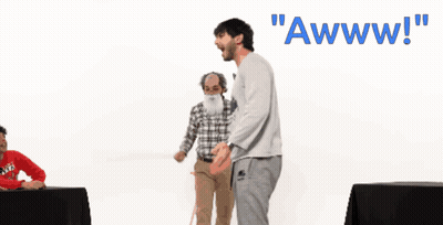 Bearded Man Kneeling In Front Of Awww Sign GIF