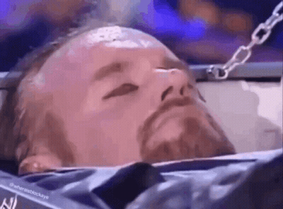 Bearded Man Laying In Cage Eyes Closed GIF